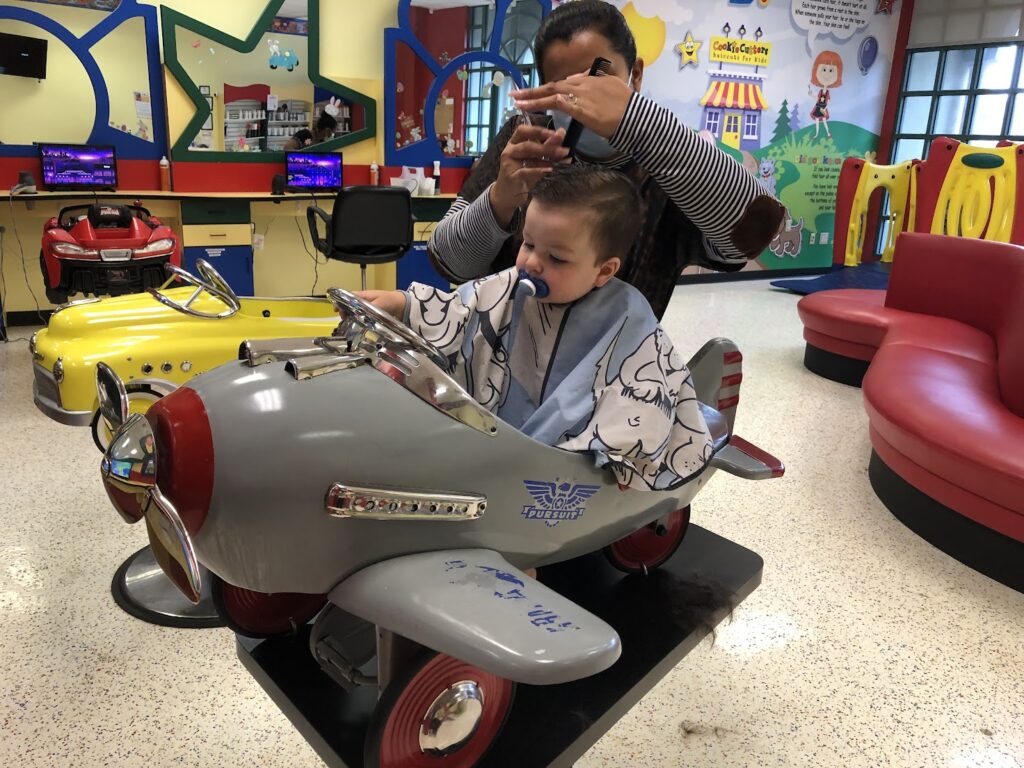 Paci during a haircut